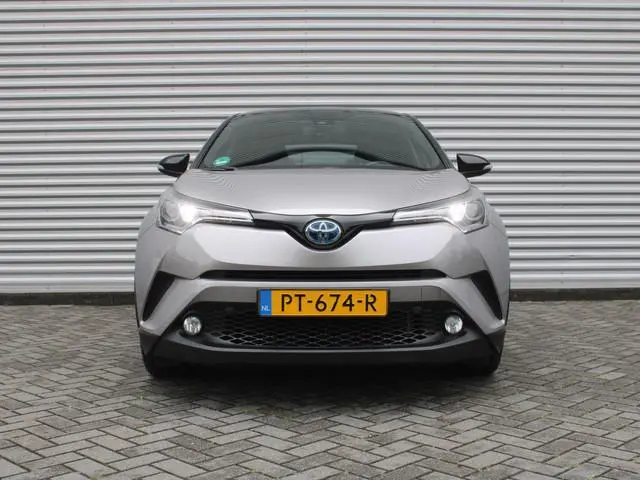Toyota C-HR 1.8 Hybrid Bi-Tone | 18" LM | Stoelverwarming | Camera | Keyless | Cruise adapt. | Clima...