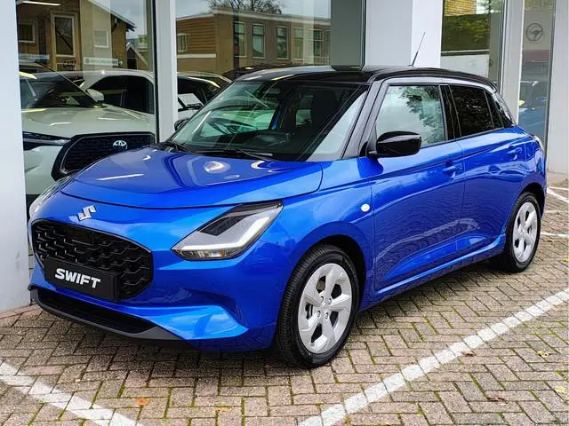 Suzuki Swift 1.2 STYLE SMART HYBRID AUTOMAAT Direct Leverbaar | Tot 10 JAAR GARANTIE! Inclusief € 2....
