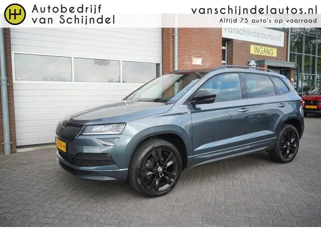 ŠKODA Karoq 1.5 TSI ACT 150PK SPORTLINE BUSINESS VOL LUXE PANORAMADAK ZWARTE HEMEL CAMERA STOEL+STUU...