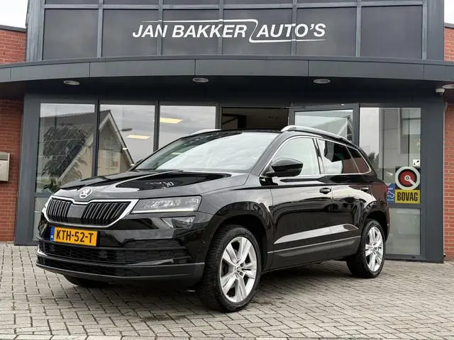 ŠKODA Karoq 1.5 TSI ACT Ambition Business ✅ CarPlay ✅ Elec.Trekhaak ✅ Climate  ✅ Stoelverwarming...